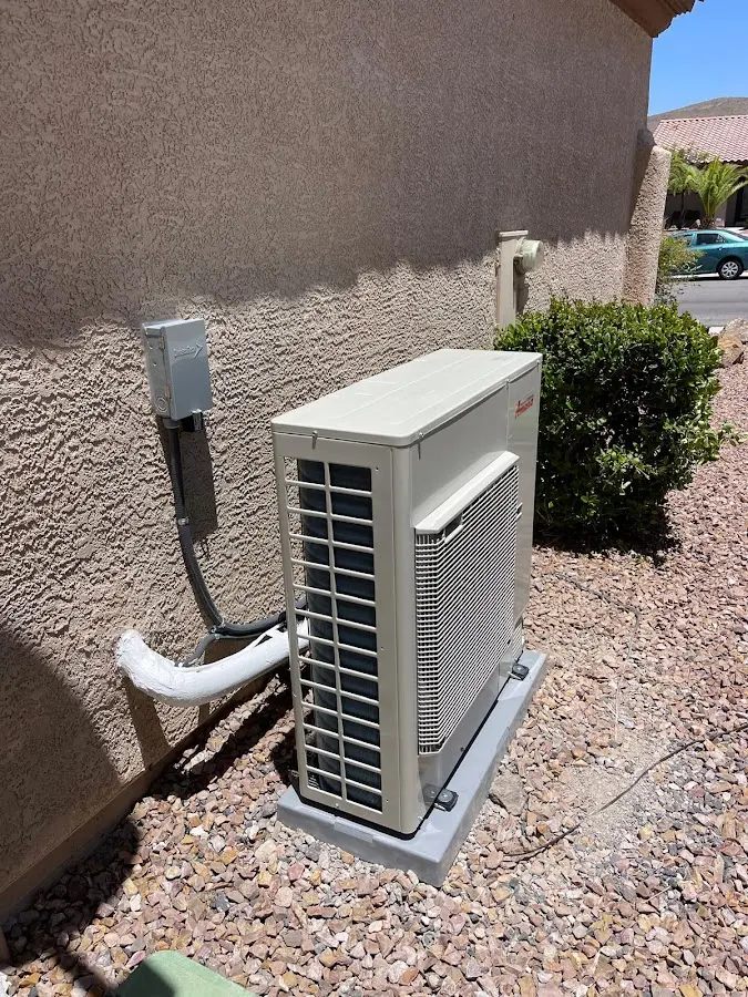 Residential air conditioning condenser unit in St. Ann